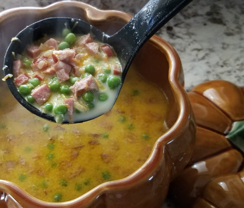 Creamy Cauldron of Carrots, Smokey Sausage, and Sweet Pea Soup