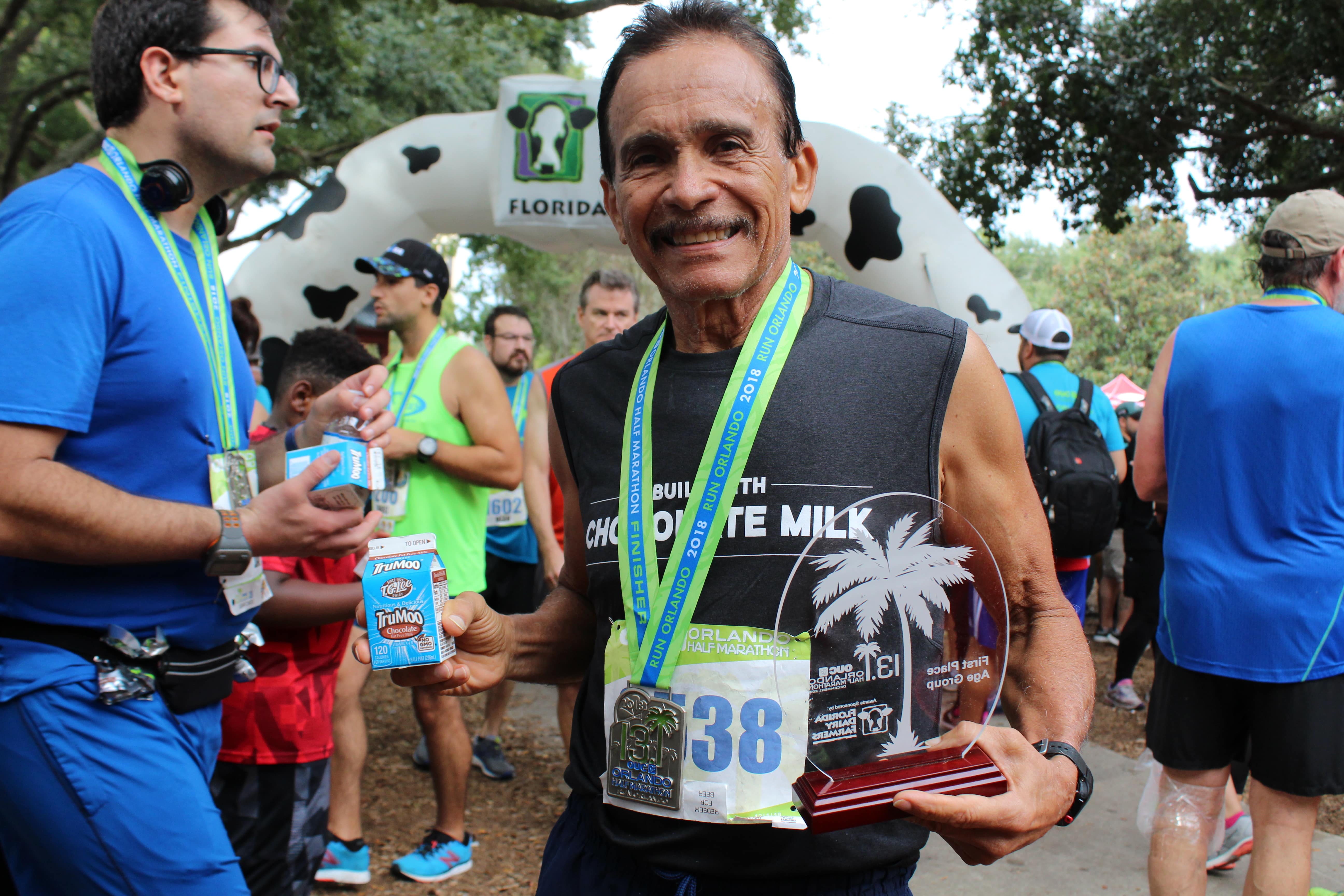 race winner holding chocolate milk