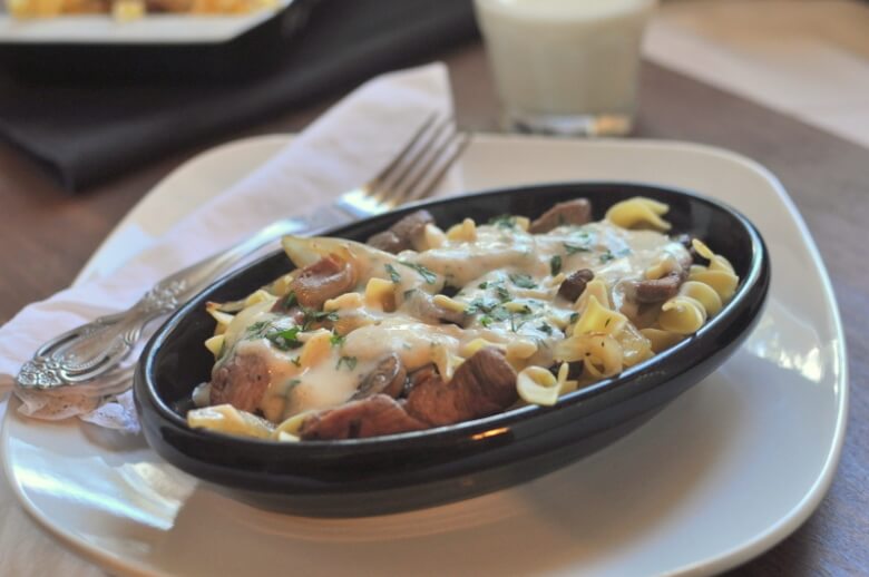 Steak Tips in Buttery Herb Sauce over Noodles Featured Image